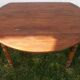 Round drop-leaf table in beech and pine