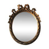 Oval golden mirror