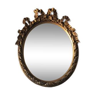 Oval golden mirror