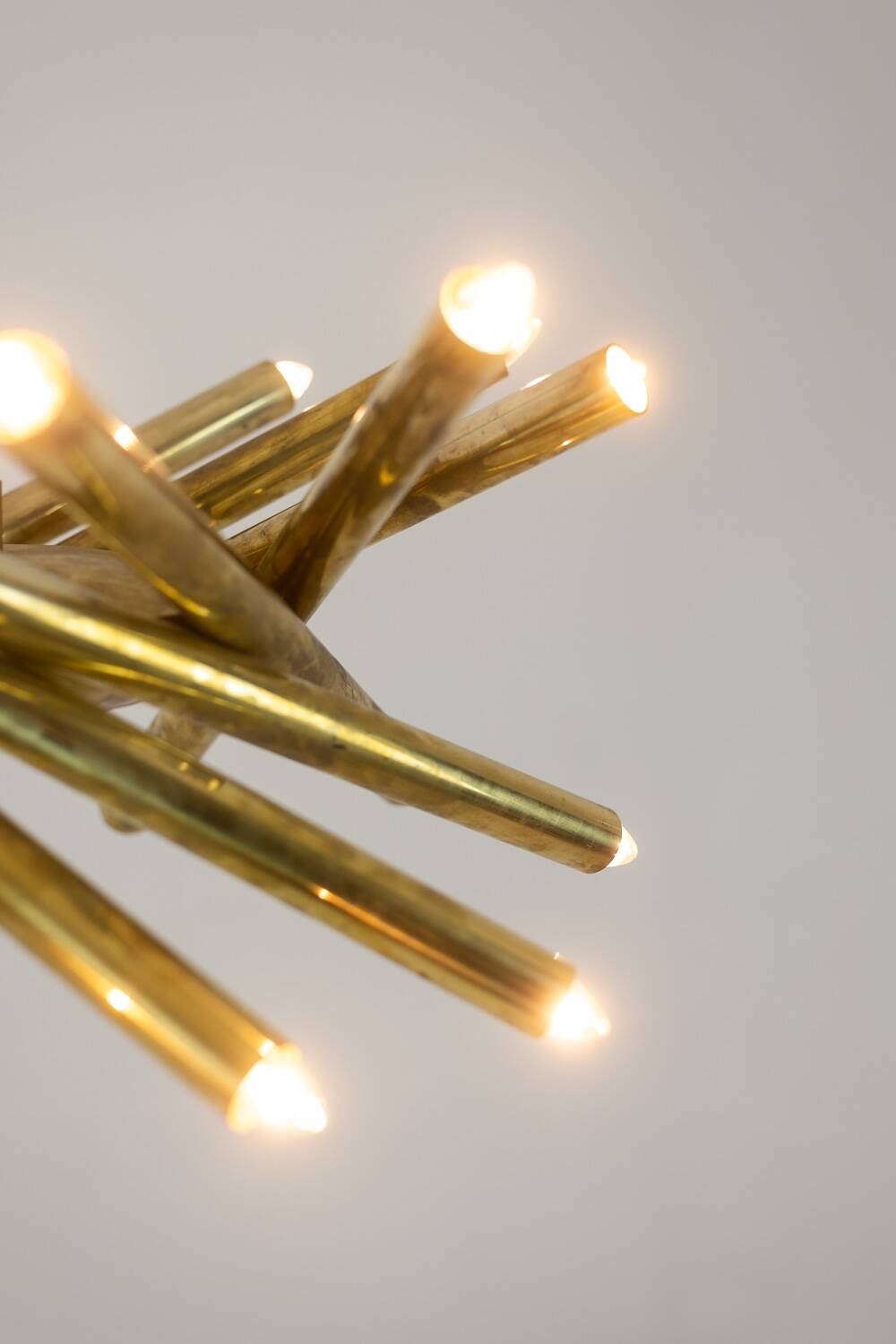 Pair of matte gold-plated brass chandeliers. Italian work from the 1970s.