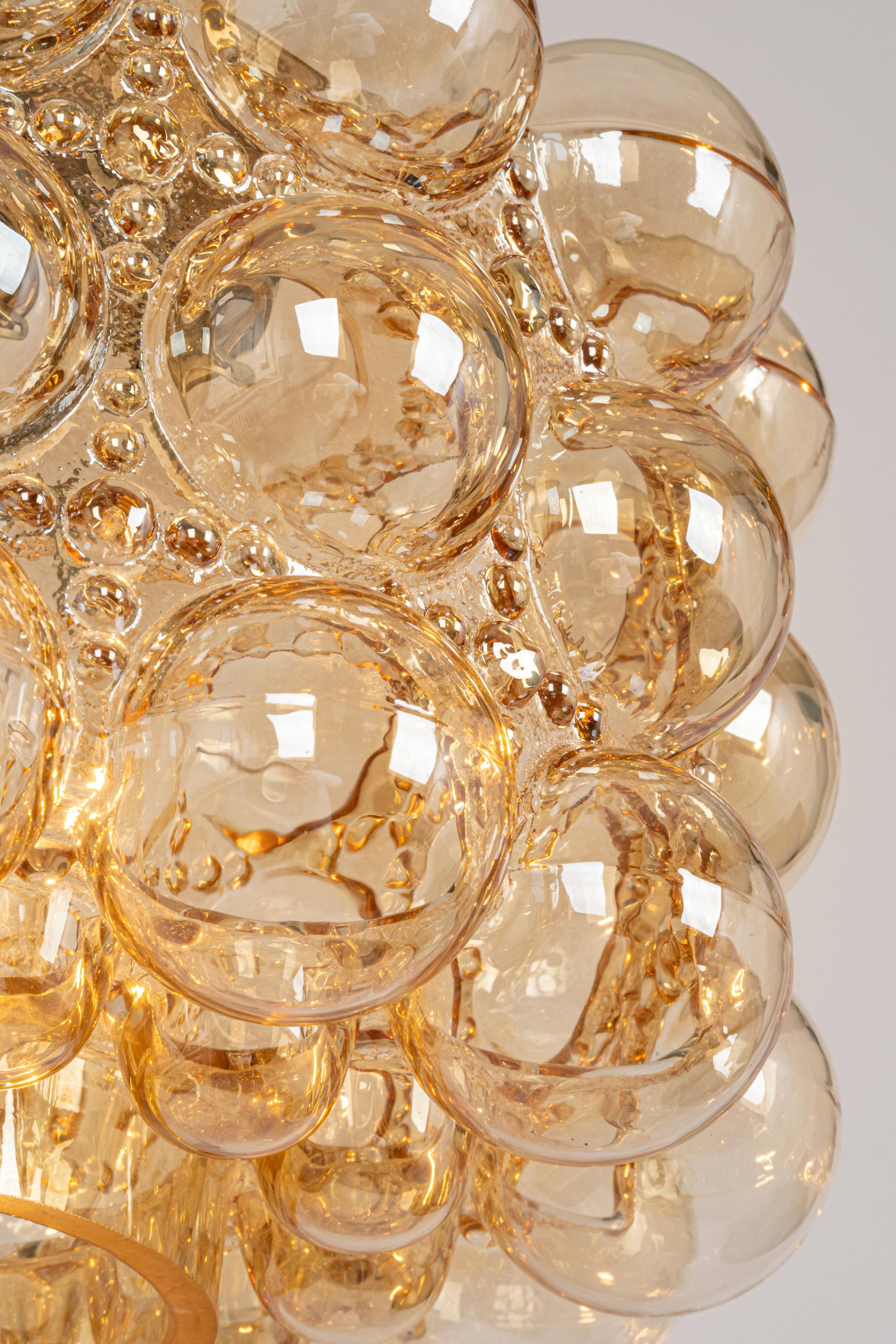 Large amber bubble glass pendant light by Helena Tynell for Limburg, Germany, 1970s.