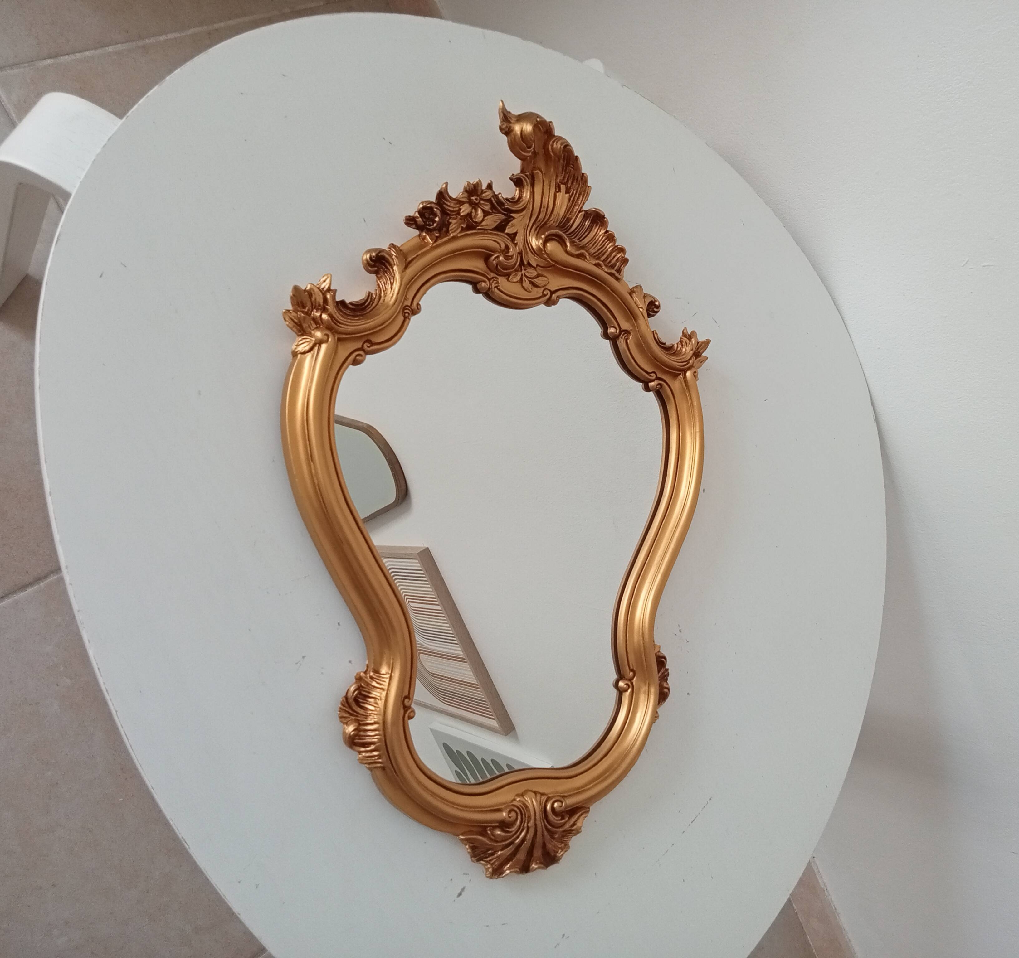 Vintage rococo mirror in gilded resin