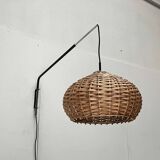 Mid-century modern Danish extendable cantilever wall lamp with a rattan shade, 1960s.