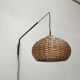 Mid-century modern Danish extendable cantilever wall lamp with a rattan shade, 1960s.