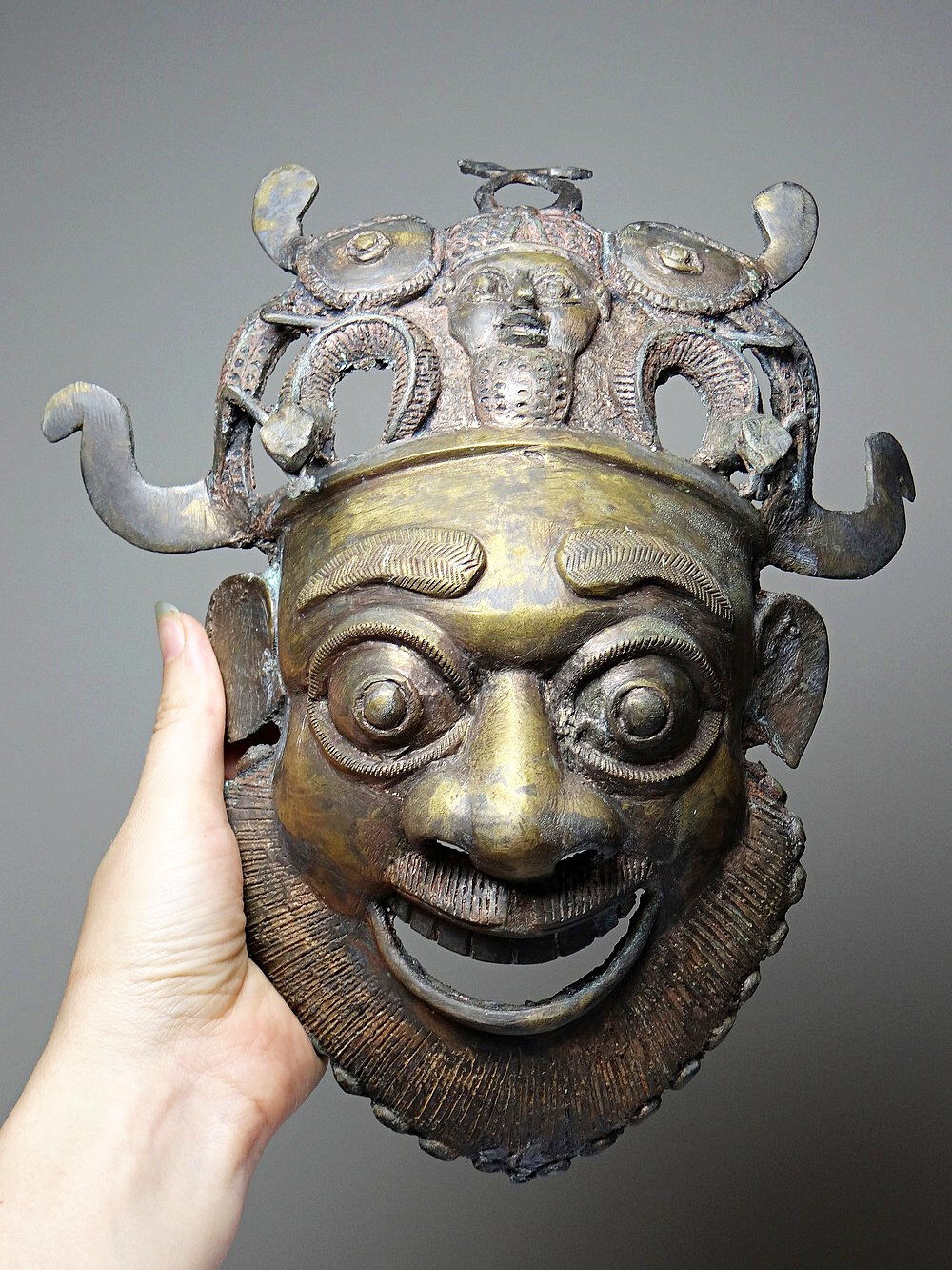 Vintage bronze African mask from Bamoun, Cameroon.
