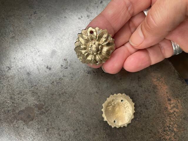 Pair of numbered antique brass rosettes for furniture decoration