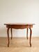 Round extendable oak dining table