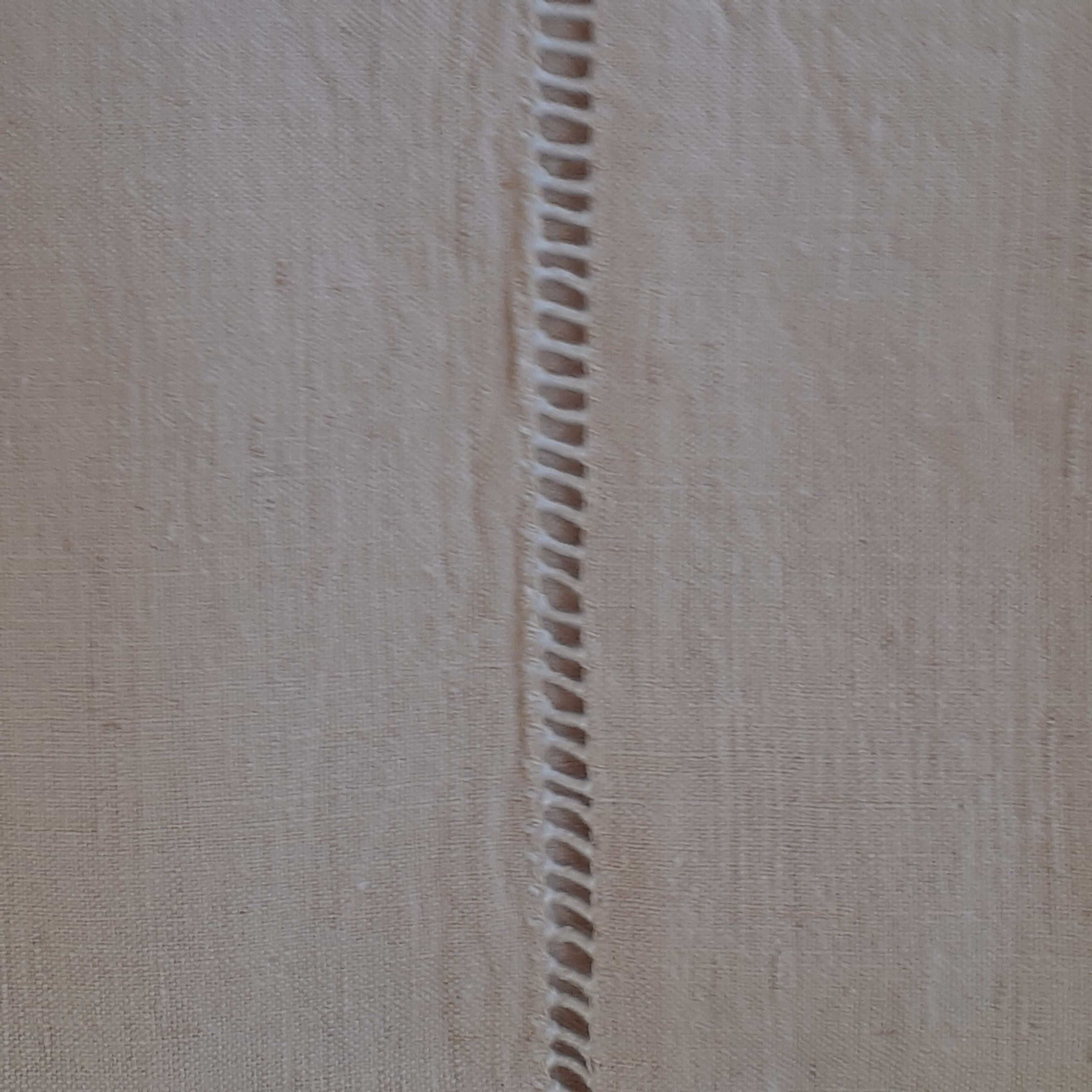 Linen sheet, bordered by a handmade day