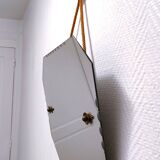 Octagonal mirror with brass hubcaps from the 60s