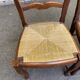 2 dining chairs with carved solid wood and rush seats in Louis XV shell style.