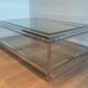 Table basse à double plateau en chrome et laiton