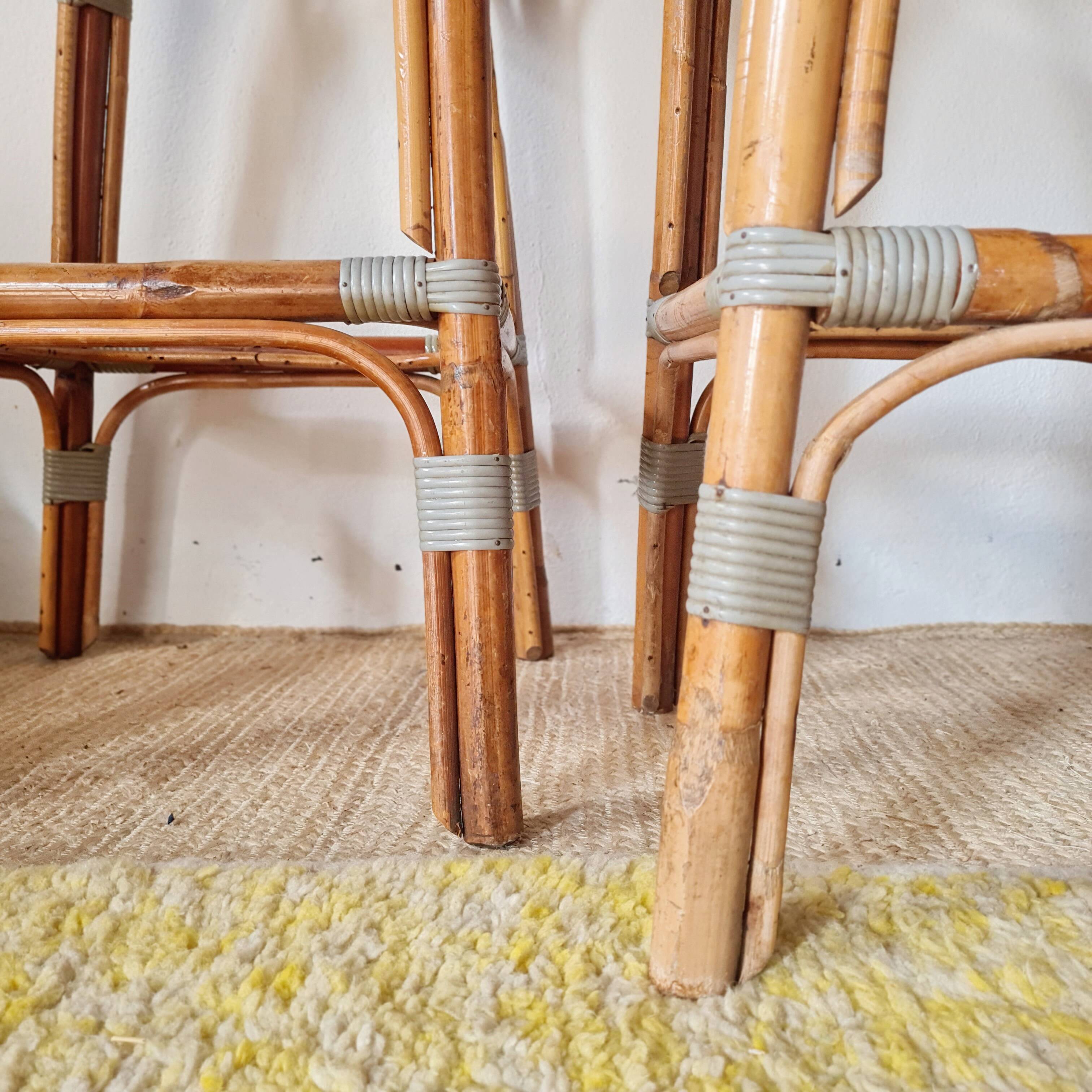 Pair of vintage Gatti bar stools in two-tone rattan and caning.