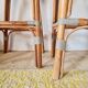 Pair of vintage Gatti bar stools in two-tone rattan and caning.