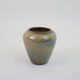 Small beige glazed ceramic vase with abstract relief pattern