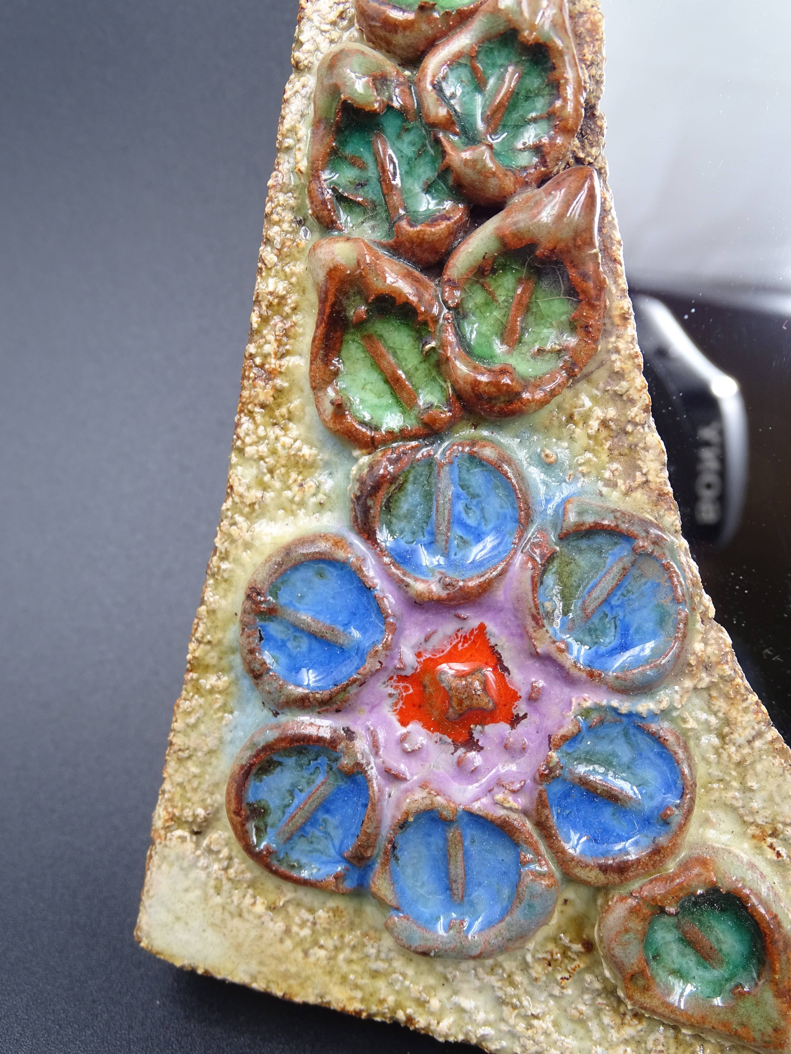 Flower-decorated sandstone mirror, circa 1970