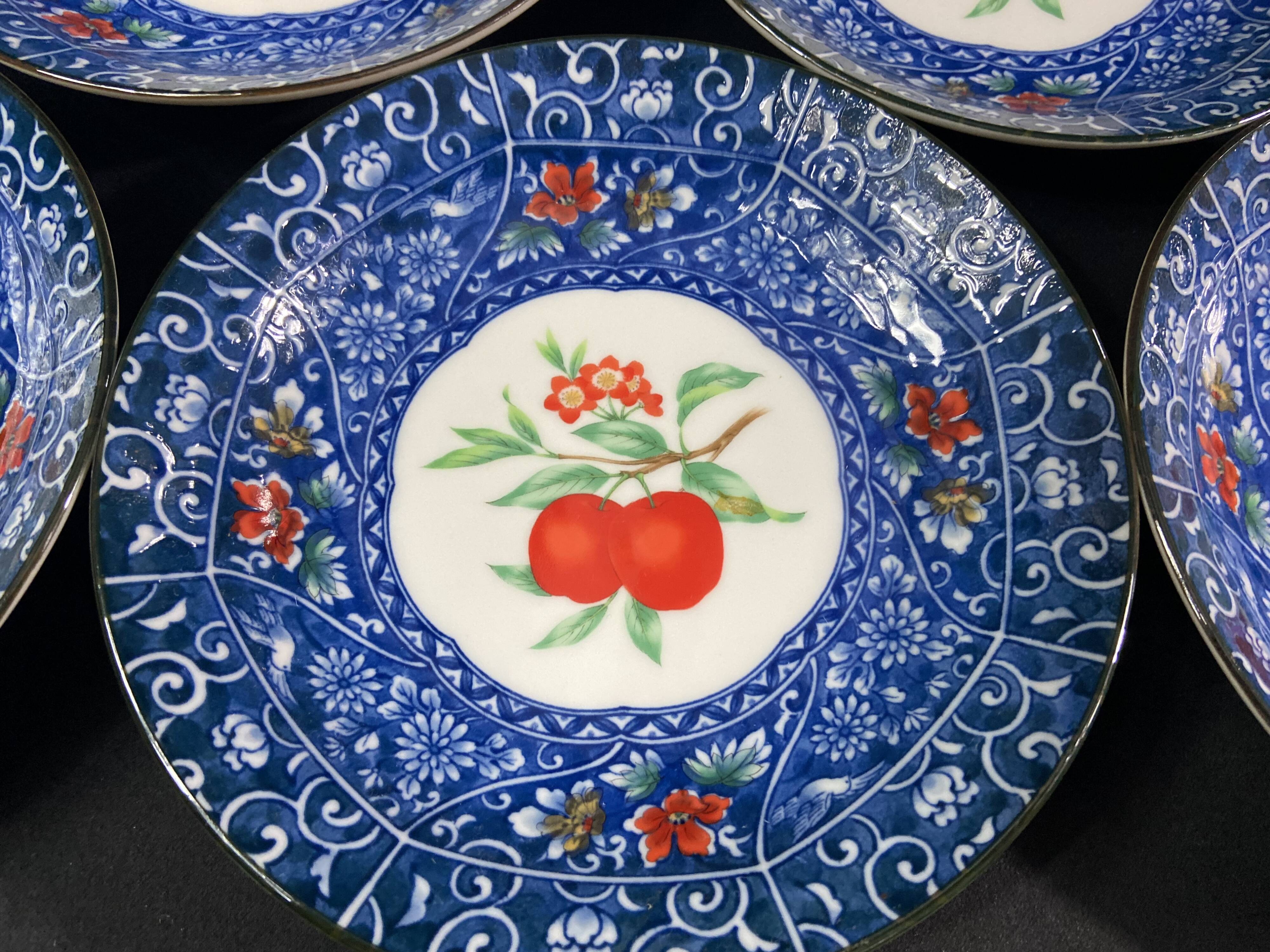 Set of 10 signed porcelain dessert plates with fruit decoration