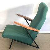 Lounge or easy chair with armrests