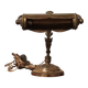 Antique desk piano lamp in chiselled brass.