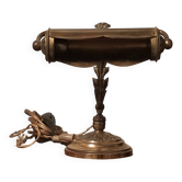 Antique desk piano lamp in chiselled brass.