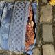 2 wooden footrests with blue cushions