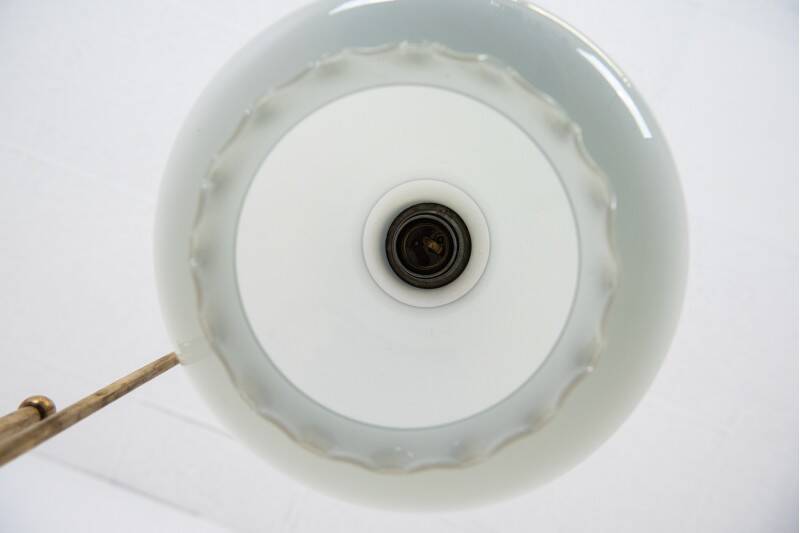 Standing metal lamp with glass shade