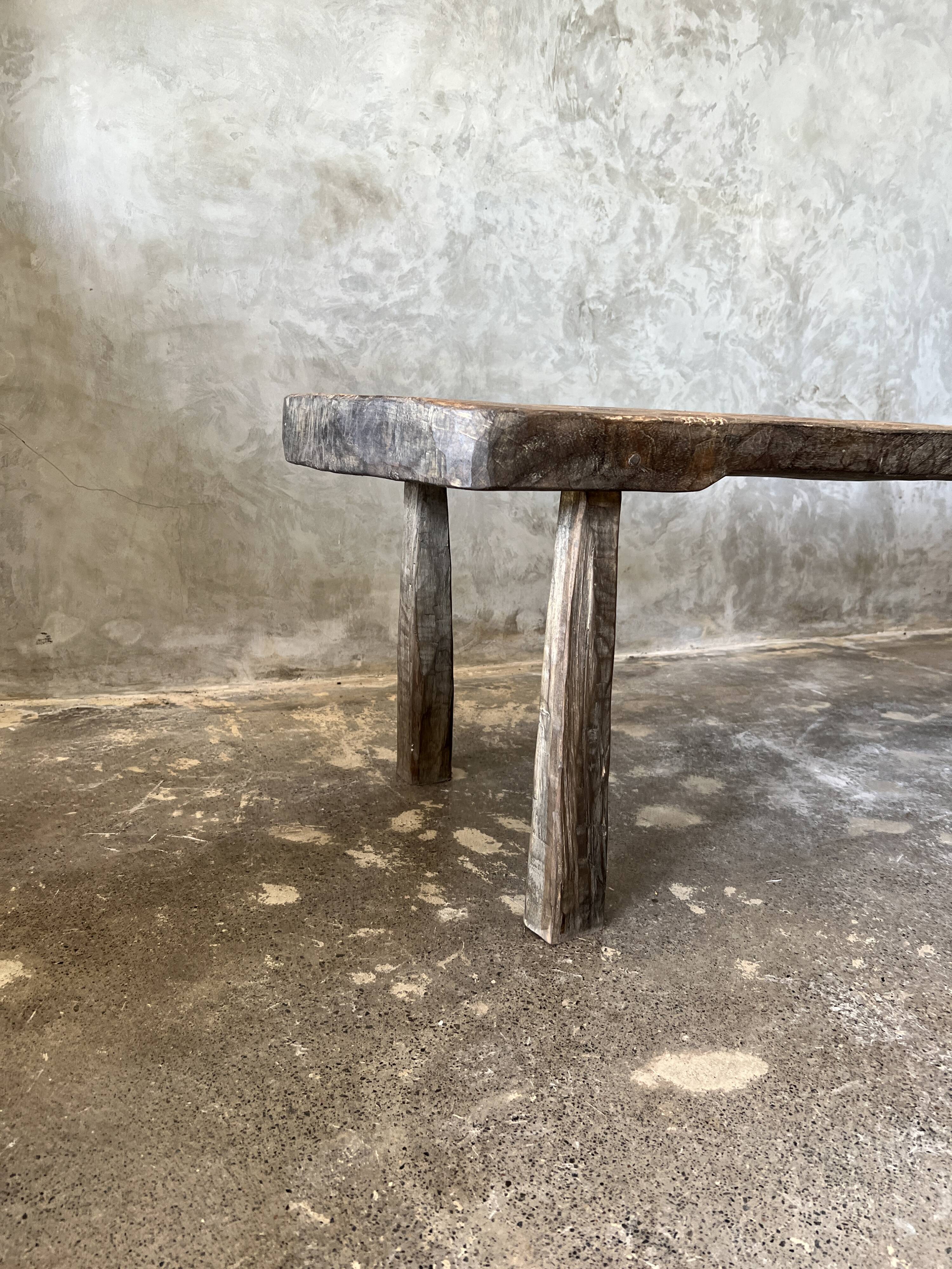 Large rounded coffee table in old Asian teak