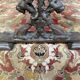 Table basse pieds fonte et plateau bois parquet