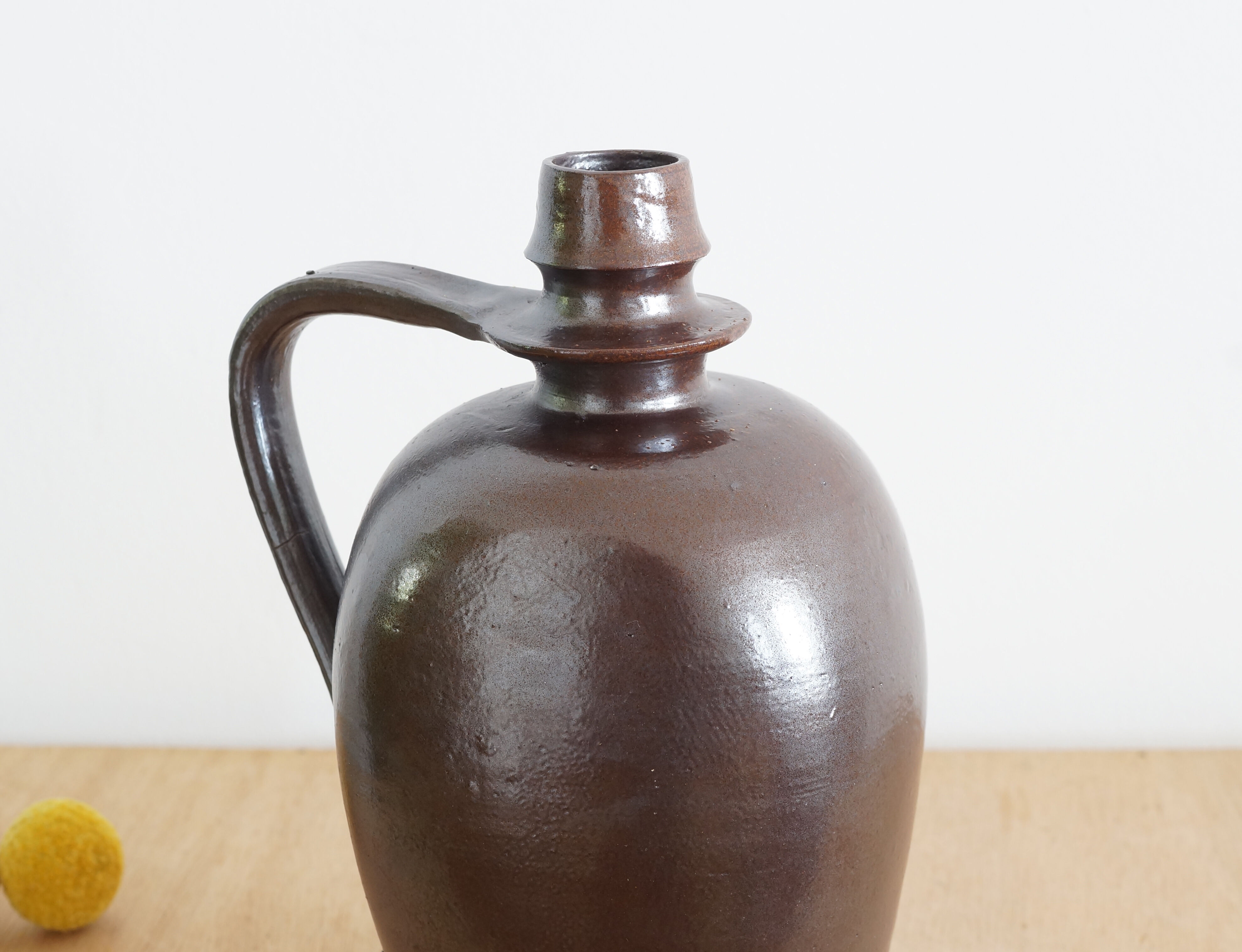 Old Norman bottle in brown ceramic