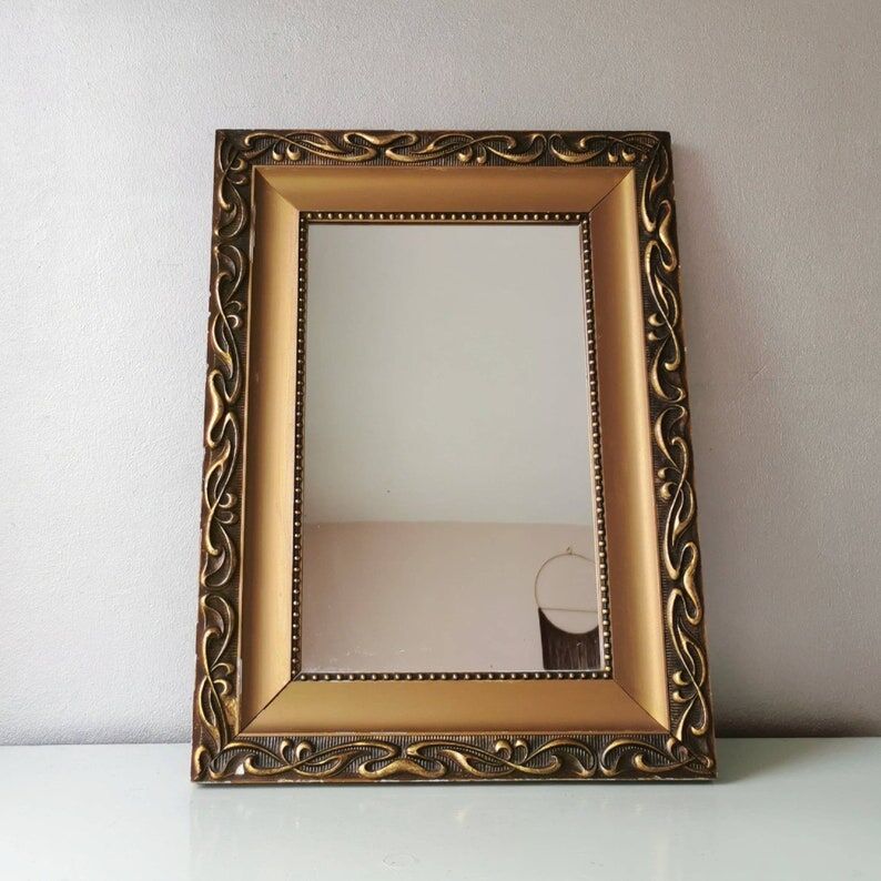 Beautiful French vintage mirror in gilded wood from the 60s