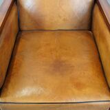 Sheep leather and wood armchair with an Art Deco design