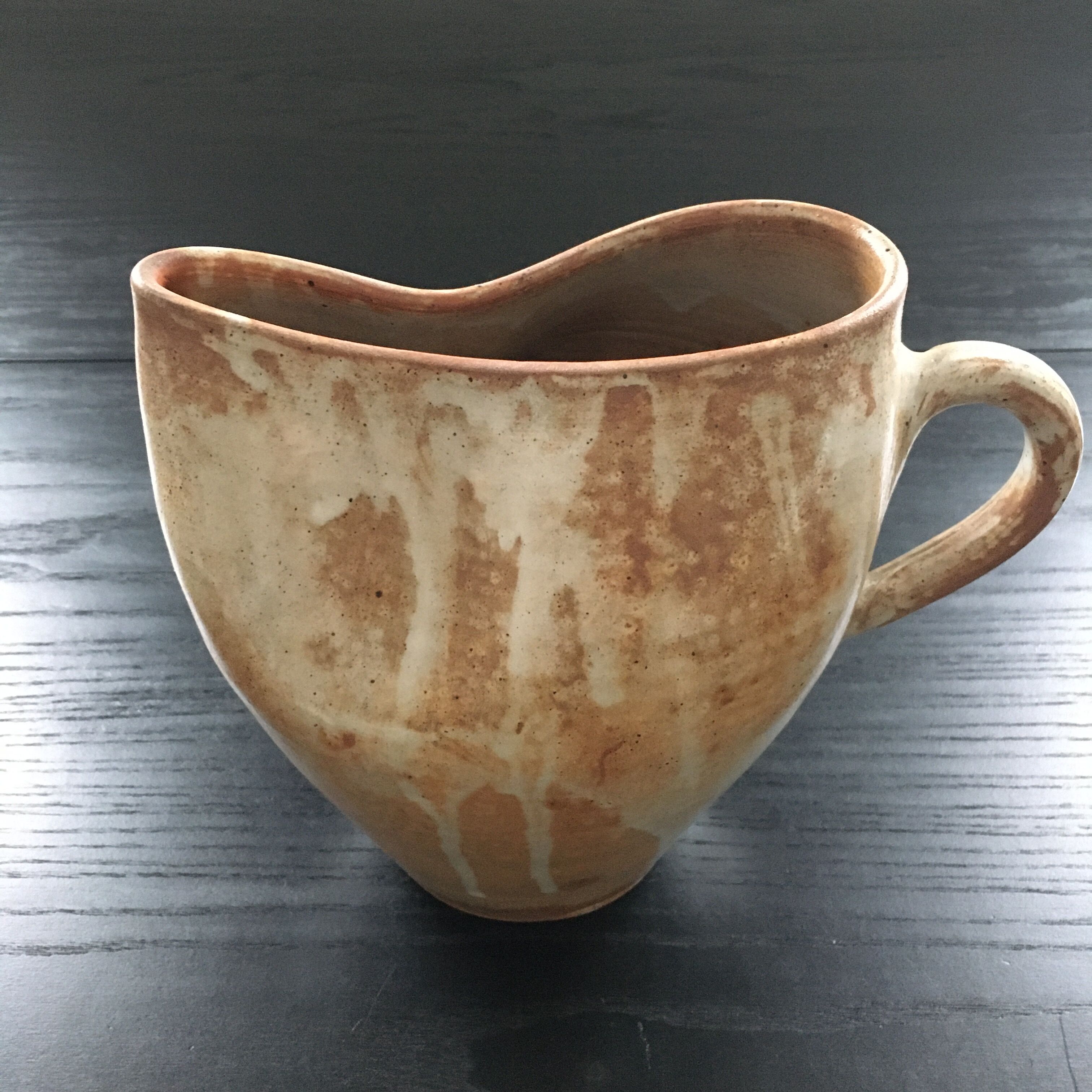 Beige stoneware pitcher with white drips