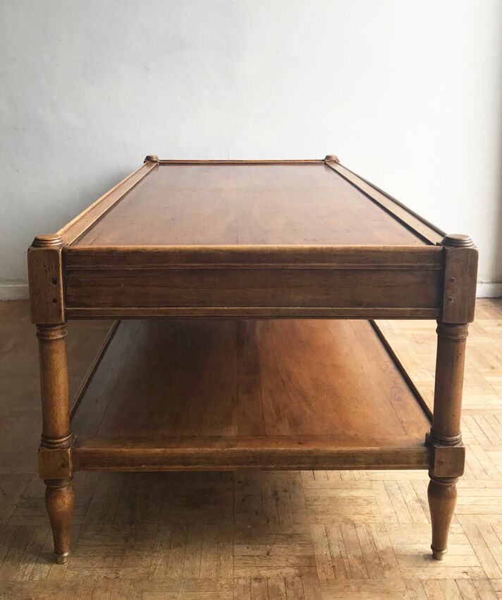 A solid wood-marked coffee table.