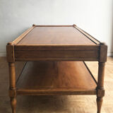 A solid wood-marked coffee table.