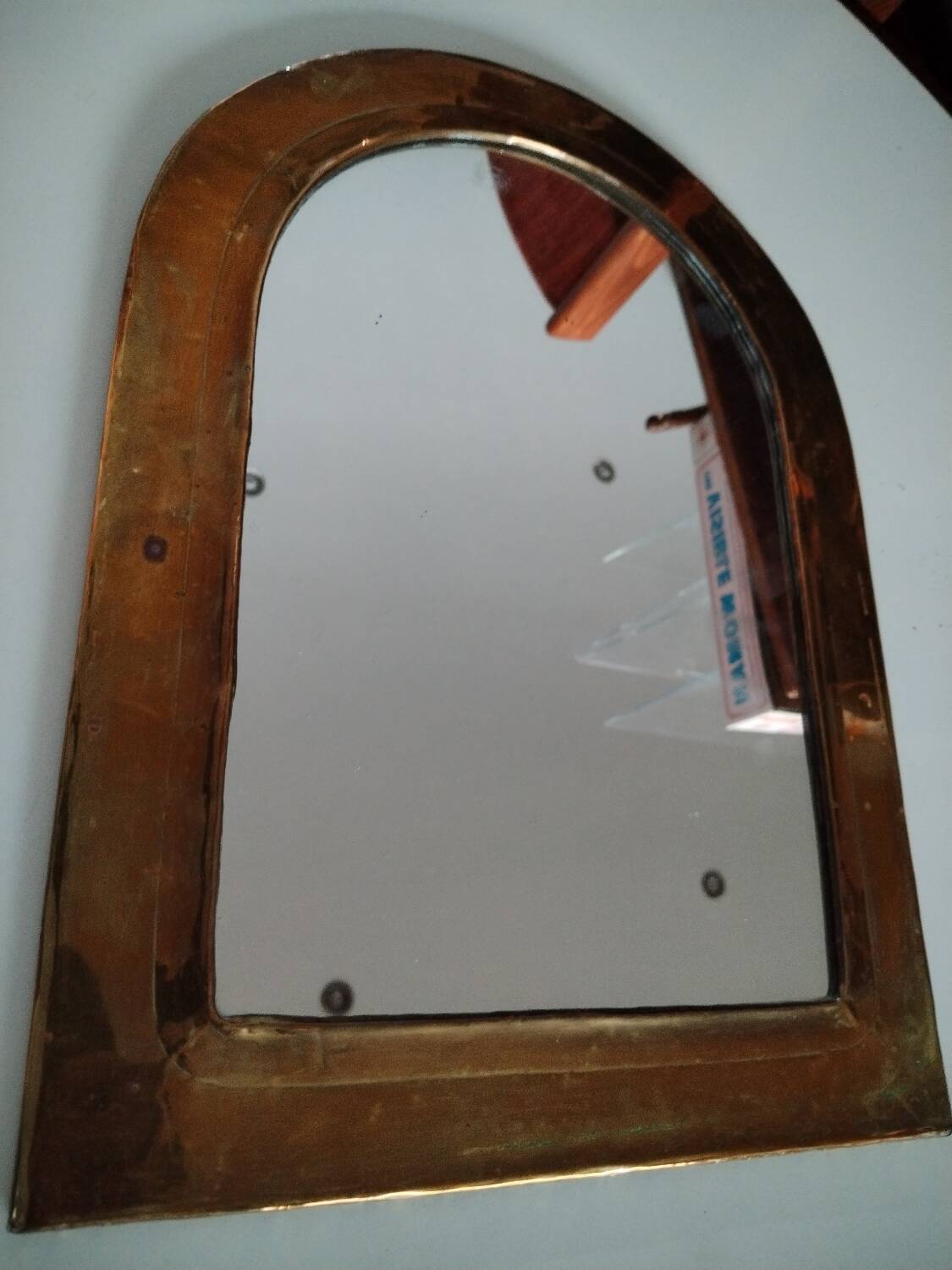 Old brass half moon mirror