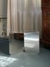 Table basse "120" en acier inoxydable, design minimaliste par métal plié.