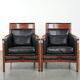 Set of 2 black leather Art Deco design armchairs in good condition