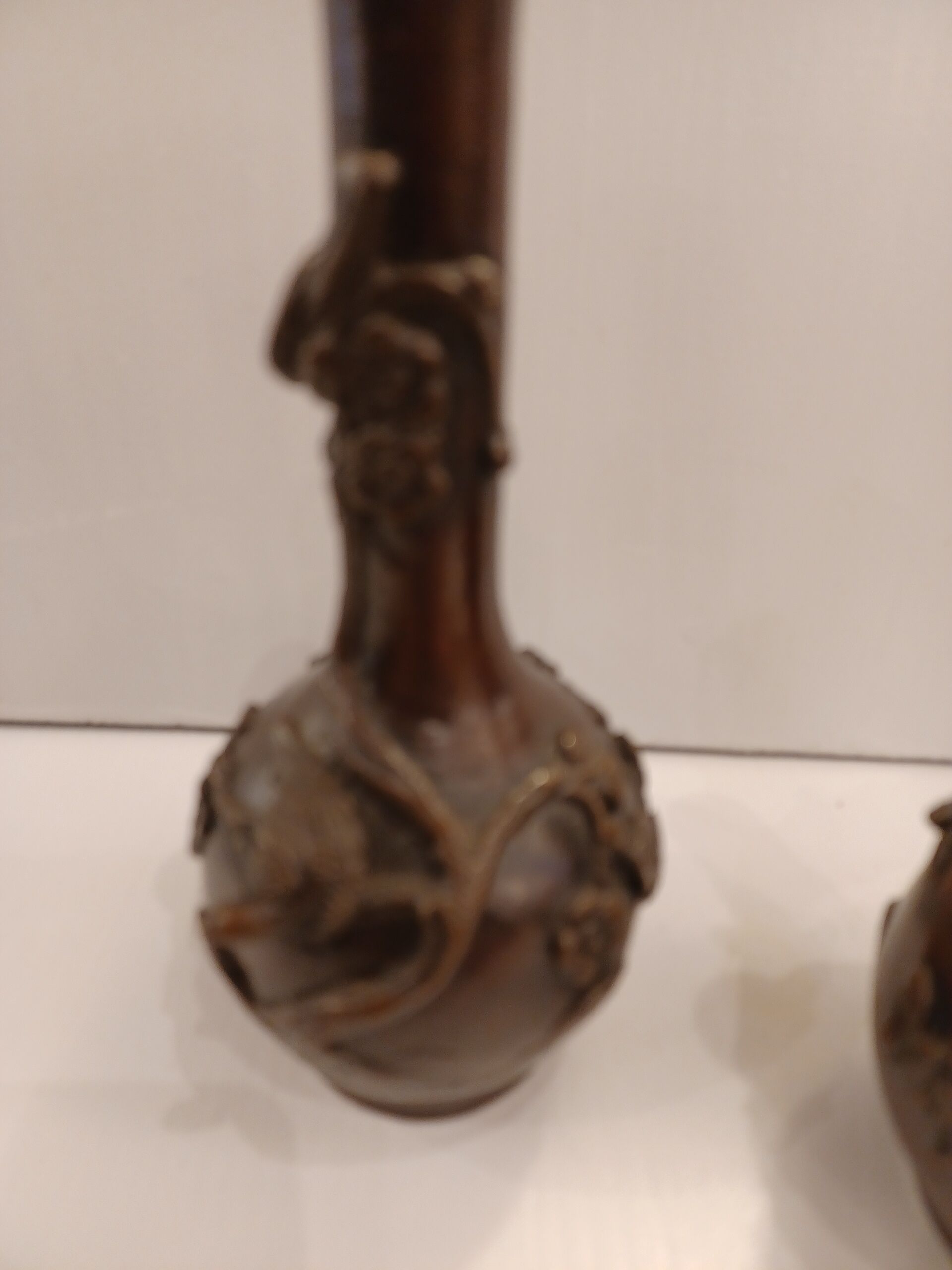 Pair of bronze soliflore vases. Japan, 19th century.