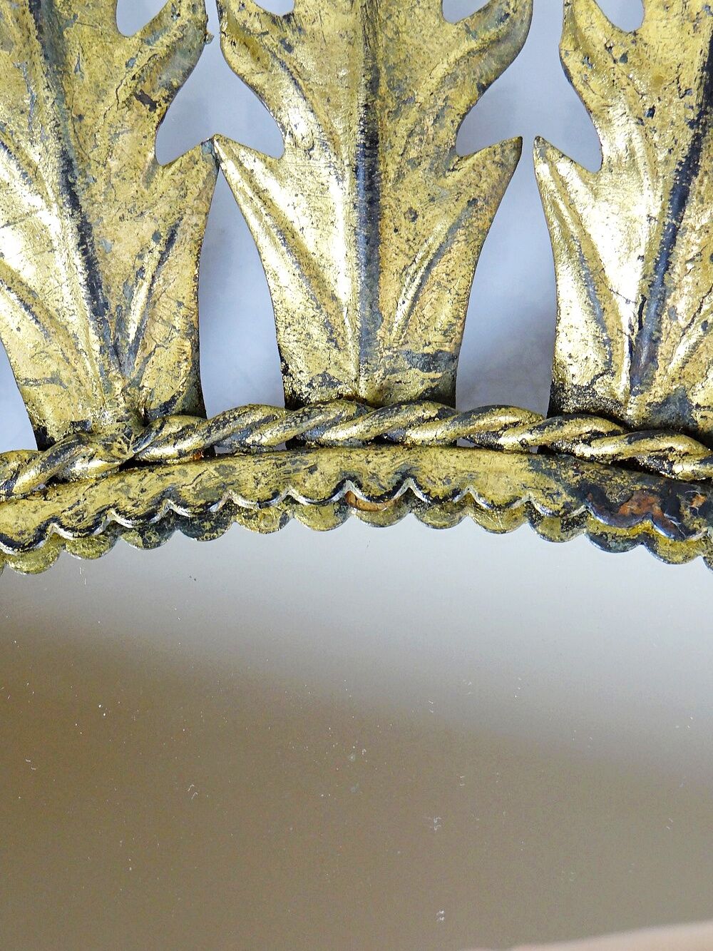 Large Italian sunburst wall mirror in gilded metal, 1960s-70s.