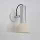 Adjustable wall spotlight in chrome-plated and white lacquered metal. 1970s