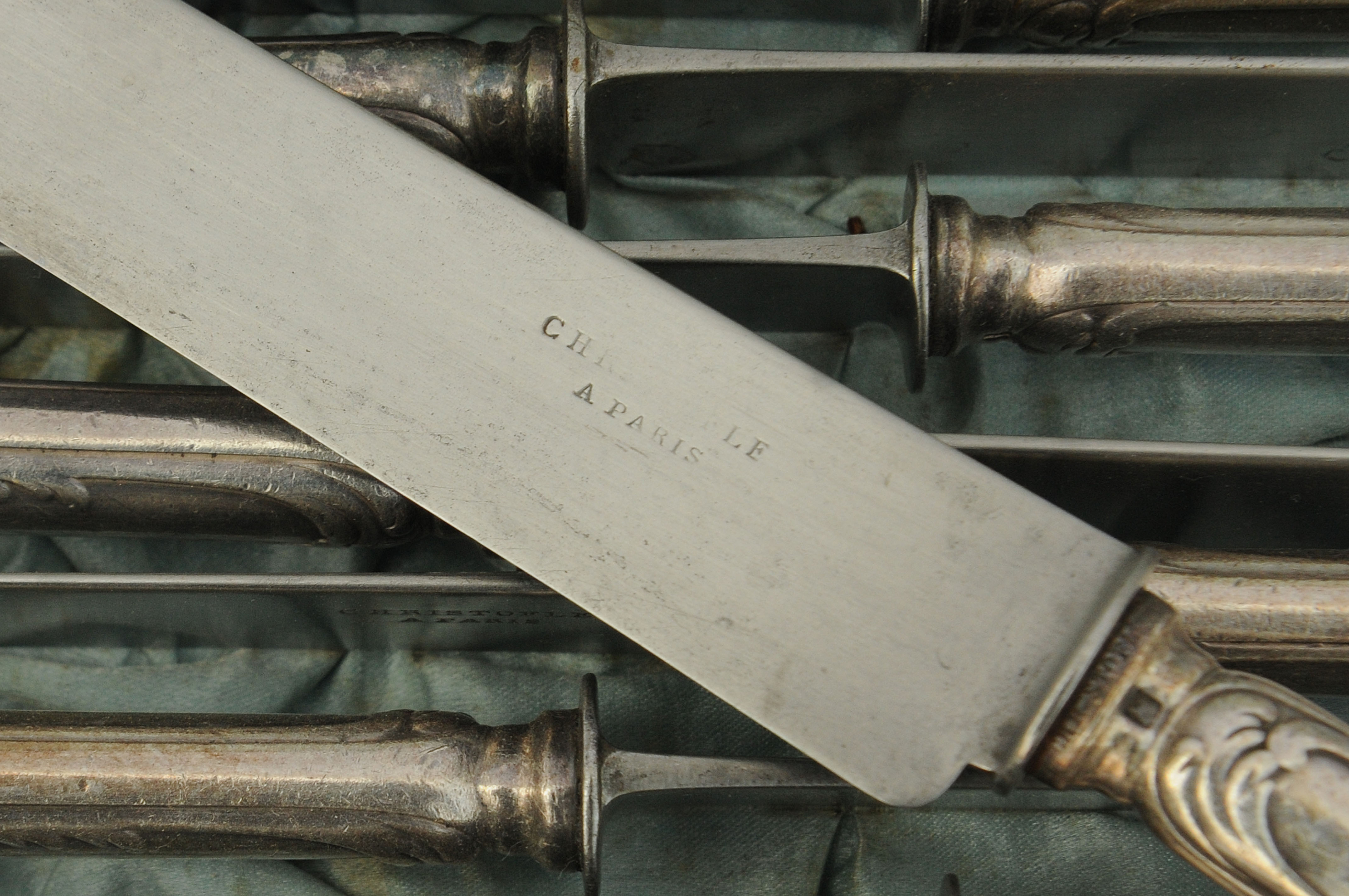 12 silver metal knives