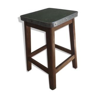 Wooden stool and green seat