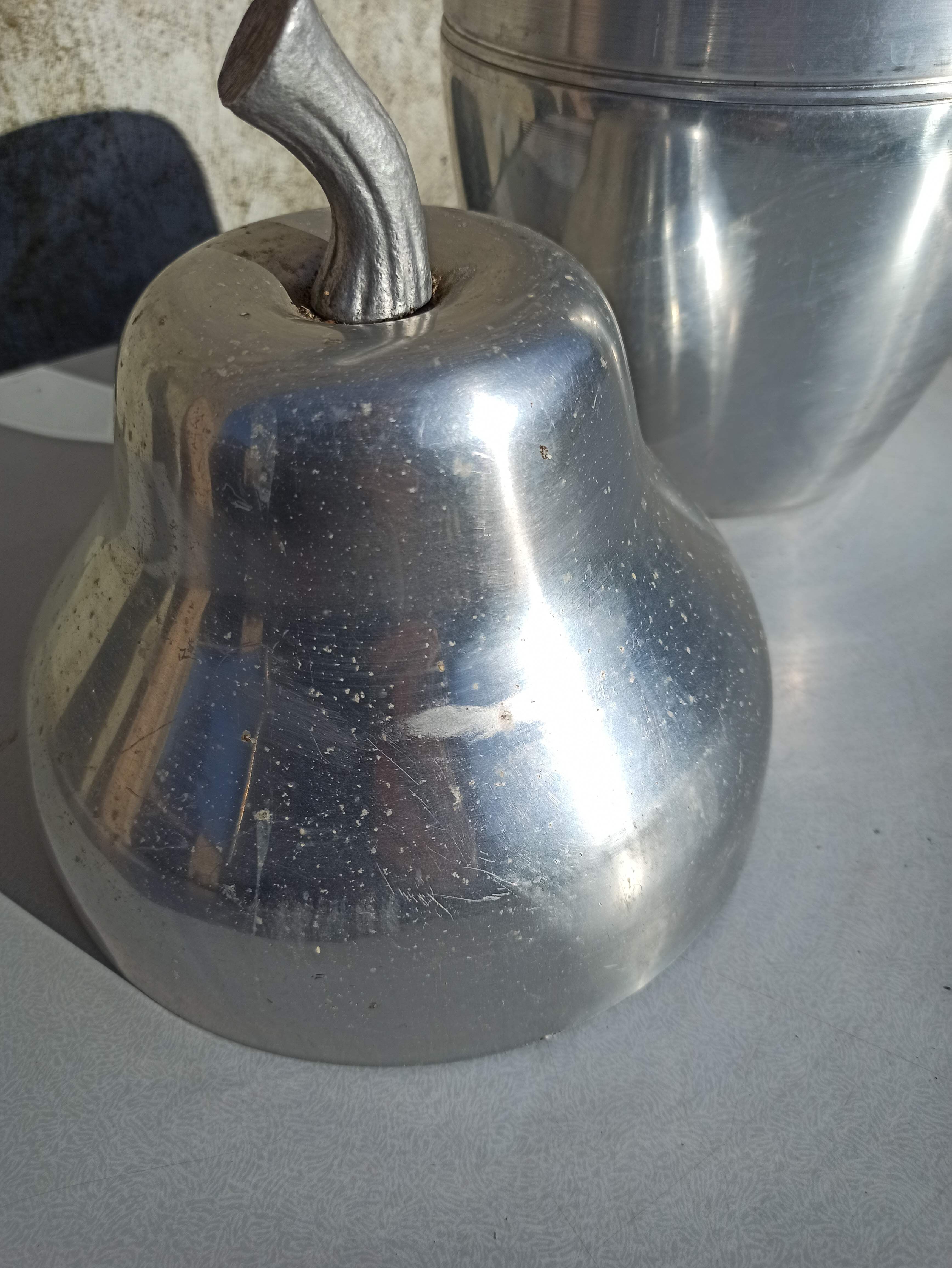 Old ice bucket ice cube in the shape of aluminum pear