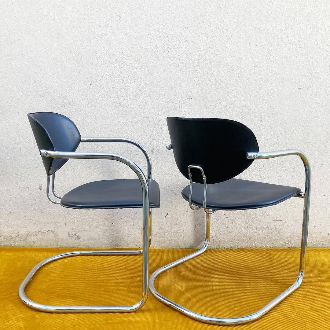 Pair of Effezeta chairs, tubular structure, chrome and black skai
