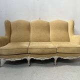 Louis XV style three-seater wingback sofa in patinated beech, 20th century