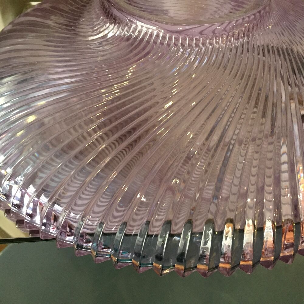 Twisted glass fruit cup of purplish pink color