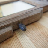 Old carved wooden pediment mirror