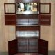 Set of three vintage hardwood military-style bookshelves.
