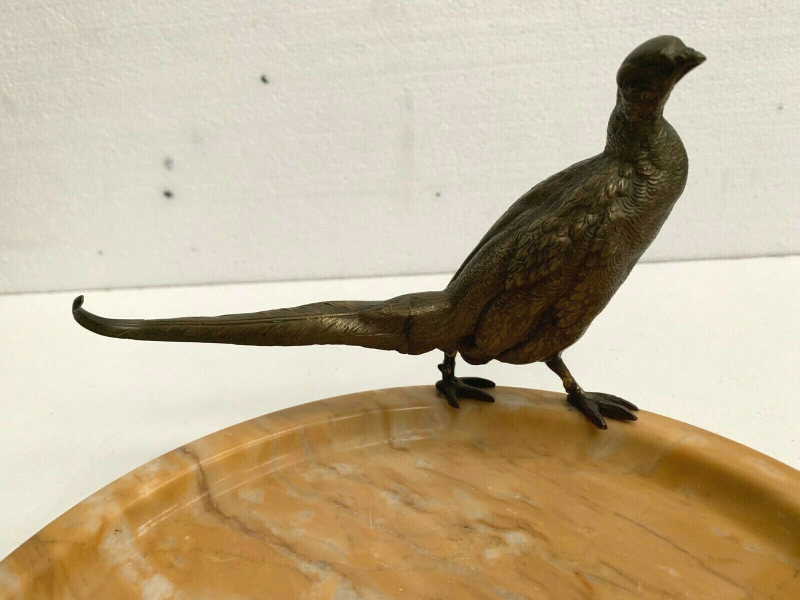 Empty marble pocket has 20th century bronze bird decoration