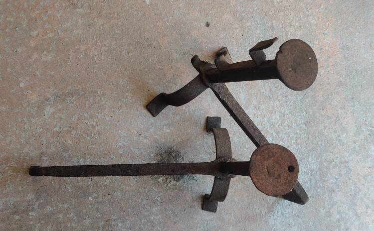 Pair of wrought iron fire dogs.