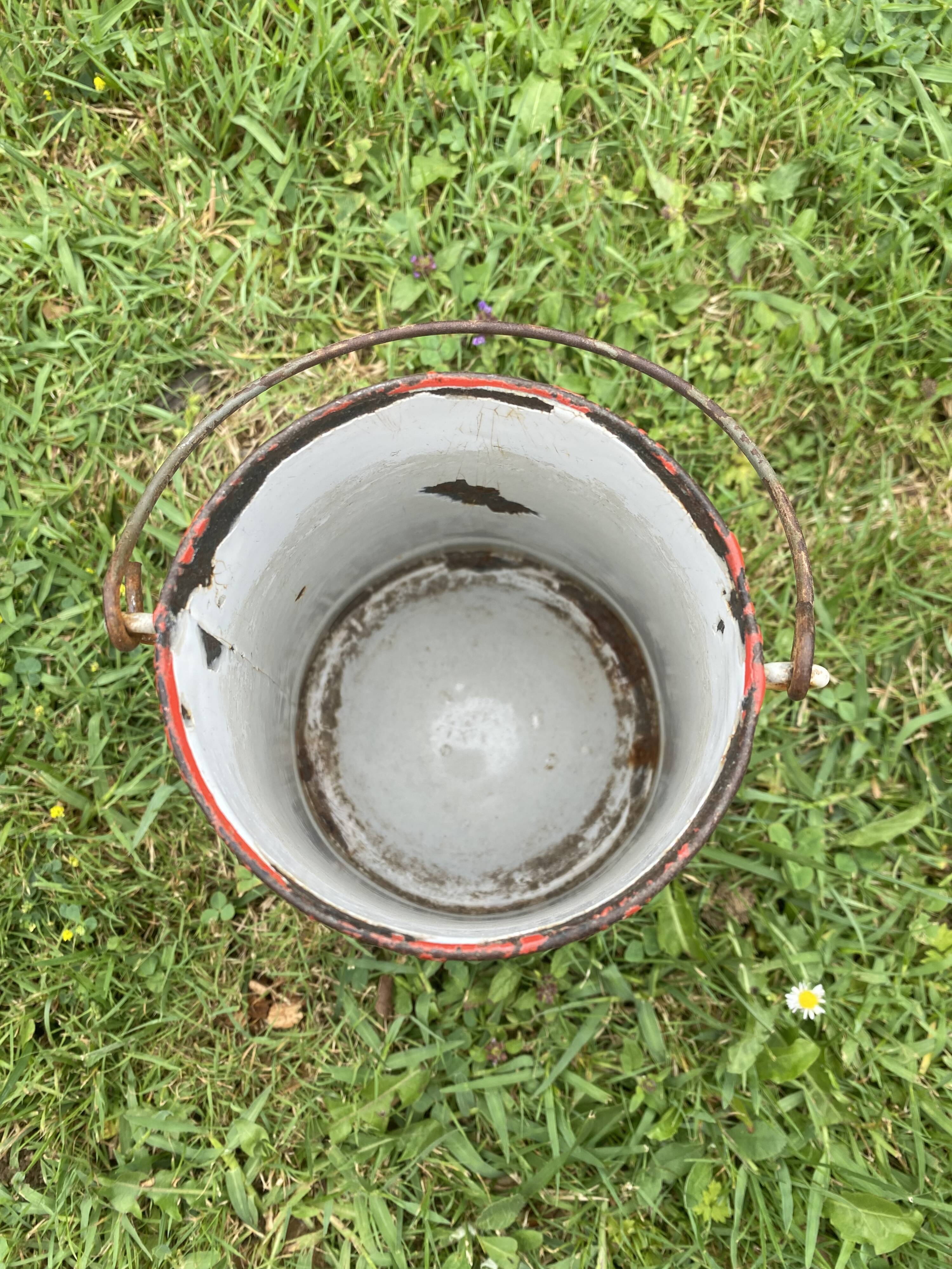 Old milk pot in enamelled sheet metal